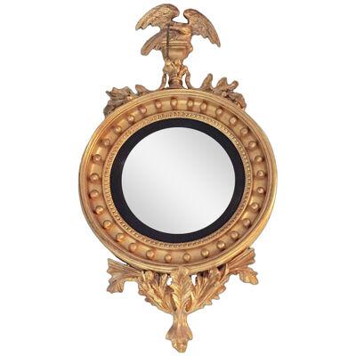 Federal Style Convex Mirror Ebony and Gilt Adorning an Eagle Winged Crest