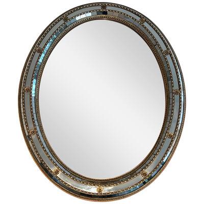 Oval Multi-facets mirror with brass garlands