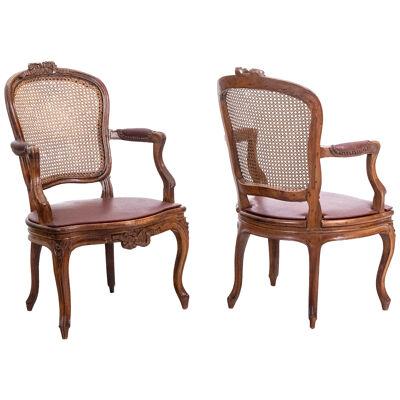 Pair of “cabriolet” armchairs in walnut and canework. Louis XV period.