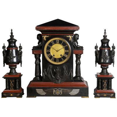 Egyptian influenced clock garniture, 19th Century.