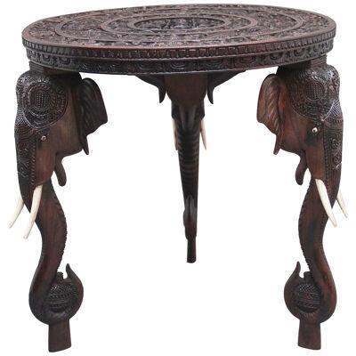 A superb quality 19th Century Anglo-Indian carved elephant occasional table