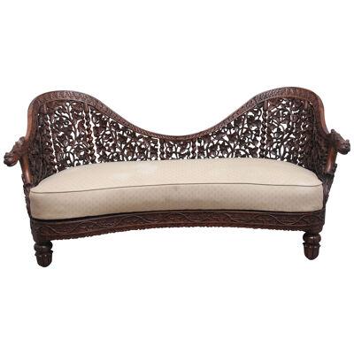 A superb quality 19th Century Anglo-Indian carved sofa