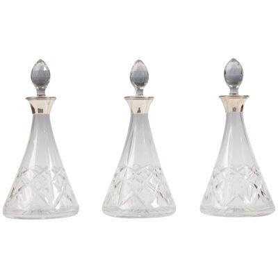 A Set Of Three Contemporary Decanters With Silver Collars £785.00