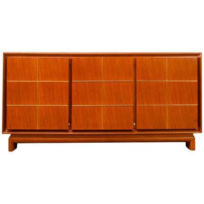 An American of Martinsville walnut mid century credenza with brass inlay. 1960.
