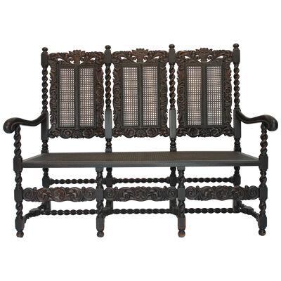 AF2-127: Late 19th Century Jacobean Style Carved Oak Caned Hall Settee