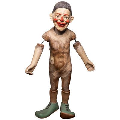 Antique Circus Clown with poseable arms and caracterful mysterious smile