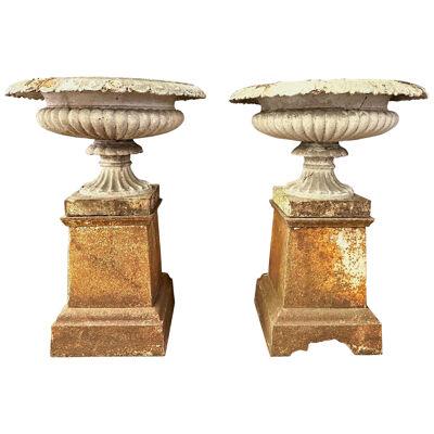 A Pair Of Antique English 19th Century Cast Iron Urns on Plinths 