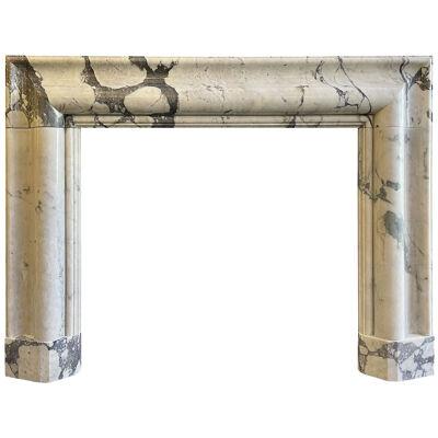 A large Breche Marble Bolection Fireplace Mantel
