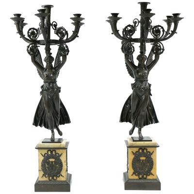 A pair of large Empire candelabra