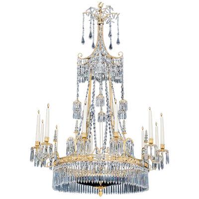 A NEOCLASSICAL SILVER & GILT BRONZE TWELVE LIGHT CHANDELIER BY WERNER & MIETH