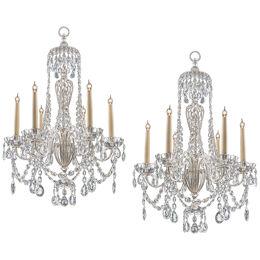 A PAIR OF SILVERED AND CRYSTAL CHANDELIERS BY OSLER & FARADAY