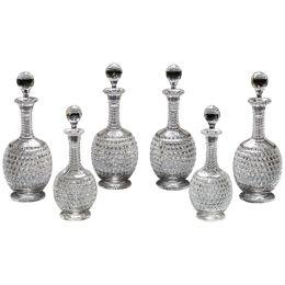 AN ELABORATELY CUT SUITE OF DECANTER