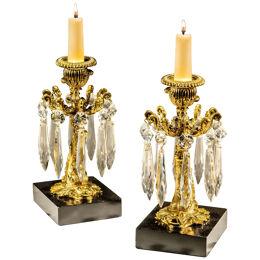 A PAIR OF GILT LACQUER DOLPHIN CANDLESTICKS