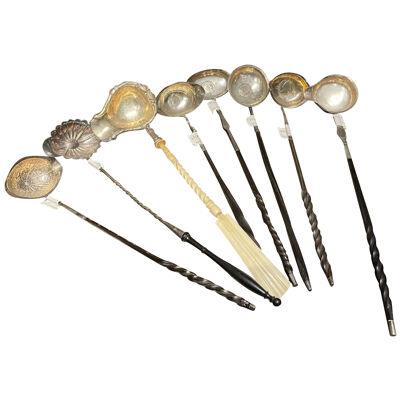A Set of eight silver 18th Century Toddy Ladles