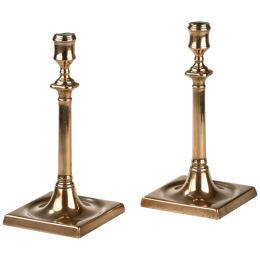Pair of Georgian square base brass candlesticks