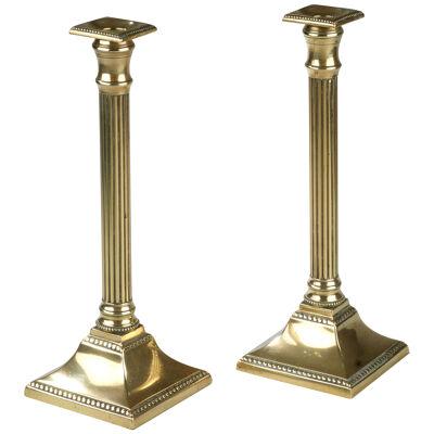 Pair of Georgian Neoclassical brass candlesticks