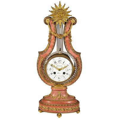 Pink marble Lyre shape mantle clock, 19th Century.
