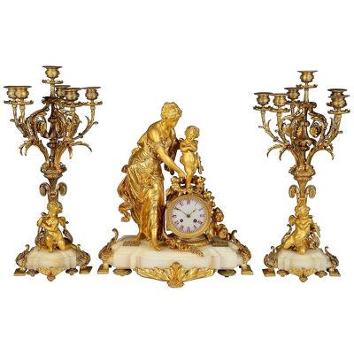 19th Century French marble and ormolu clock garniture.