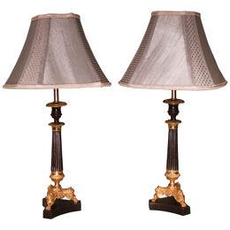 A pair of mid 19th century period bronze and ormolu candlestick lamps