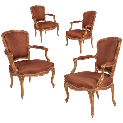 A set of four Louis XV carved giltwood fauteuils