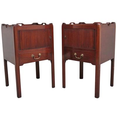 A pair of mahogany tray top bedside cabinets in the Georgian style