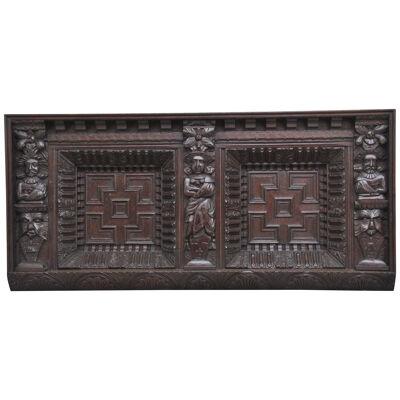17th Century and later carved oak overmantle