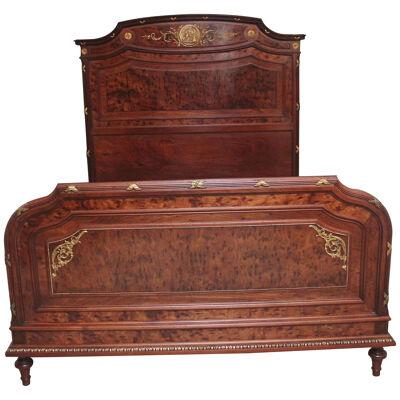 A fabulous quality 19th Century French plum pudding mahogany bed