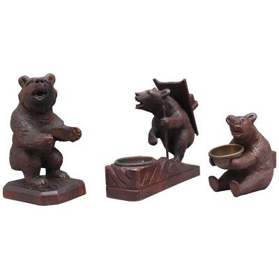 A set of three 19th Century black forest carvings of bears in different poses